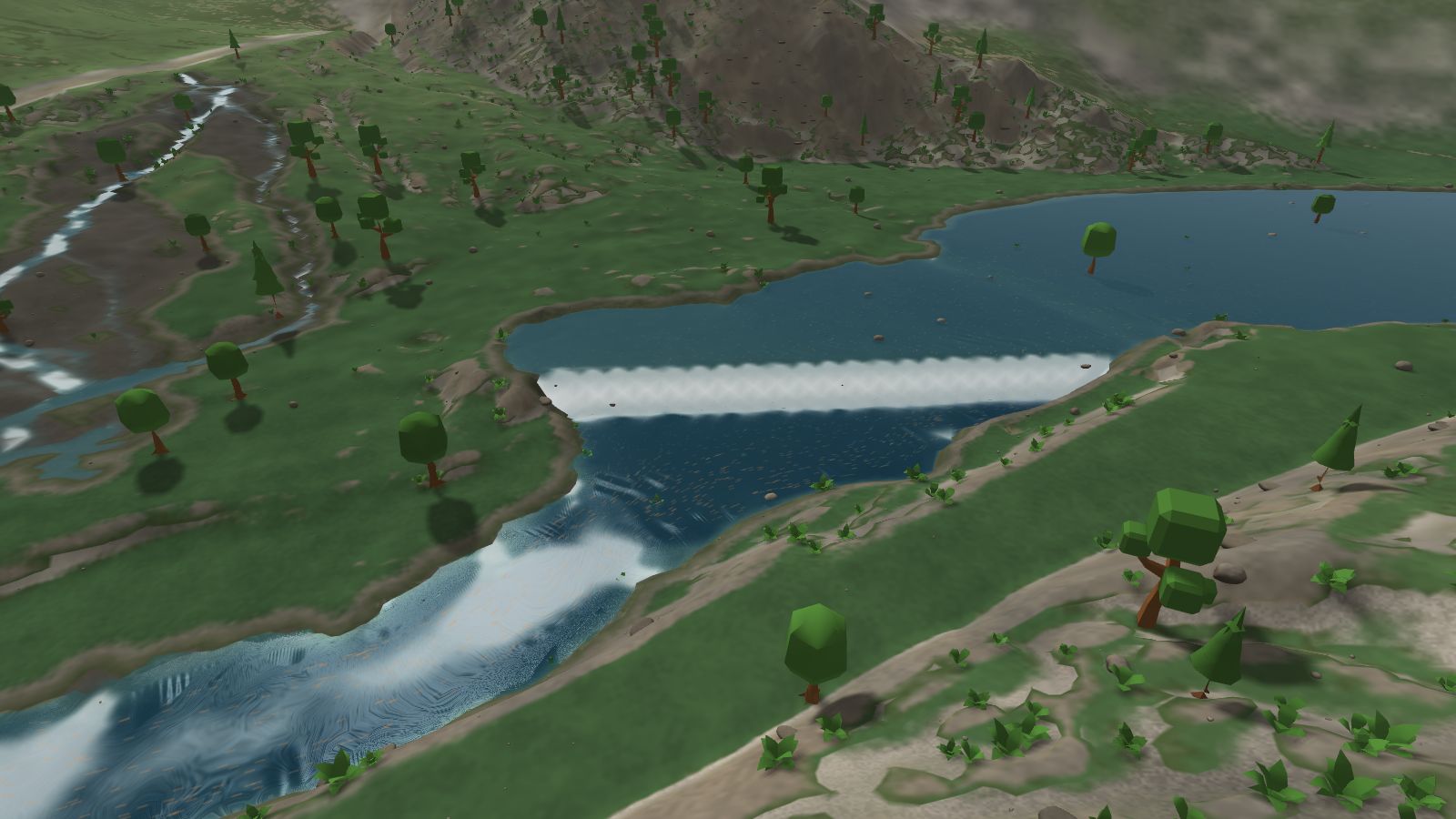The Wenatchee River pouring over Tumwater Dam, with white water in the canyon below
